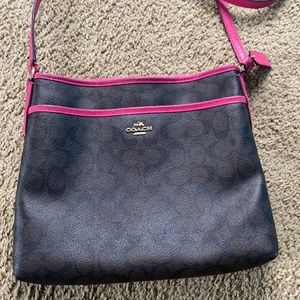 Brown and hot pink cross body purse.